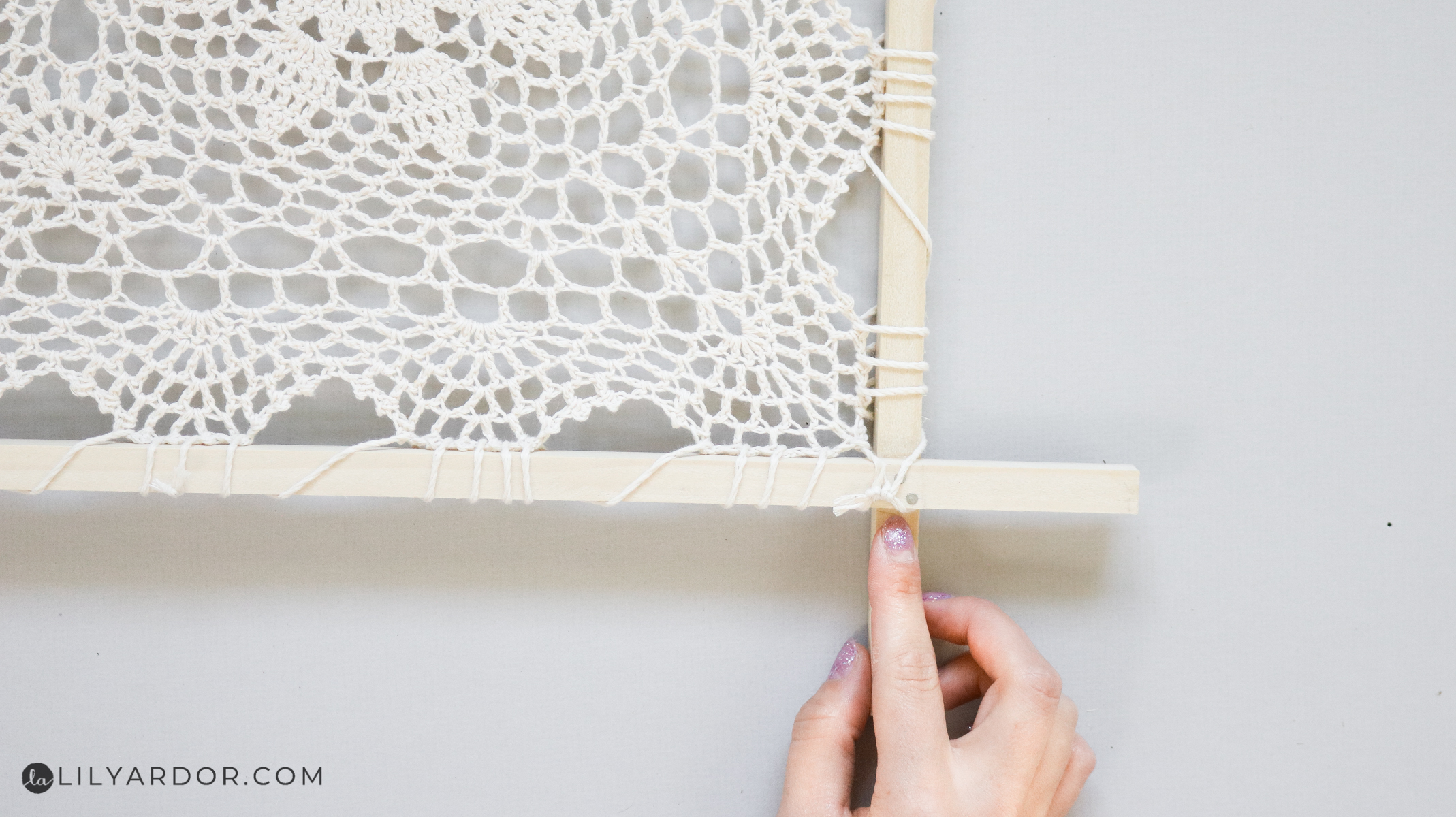 attaching the doily to the frame