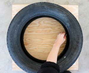 tracing a tire onto plywood