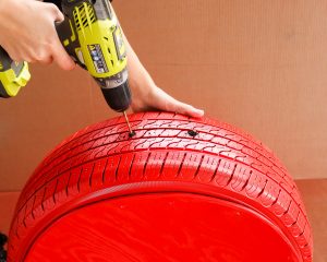 drilling two holes in a tire
